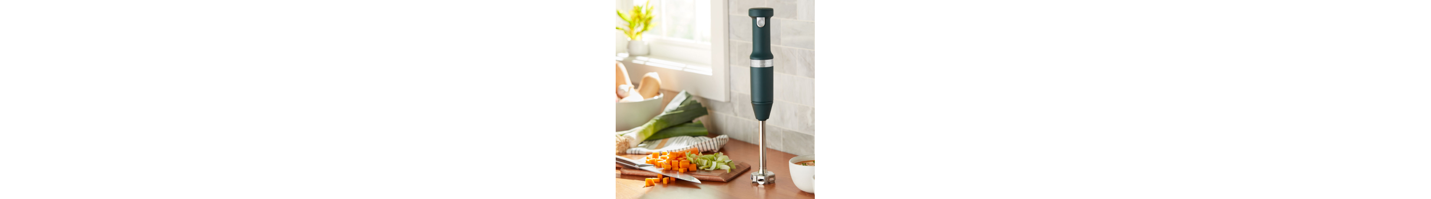 KitchenAid® immersion blender on countertop with chopped vegetables