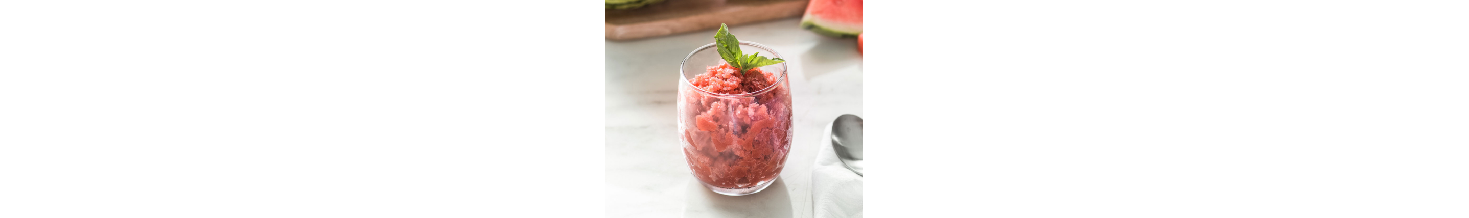 Strawberry granita garnished with basil