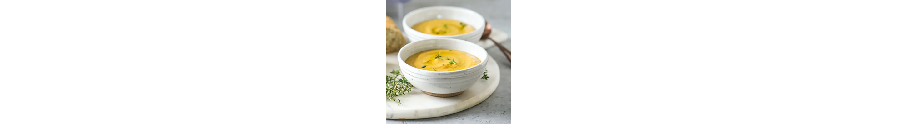 Two bowls of creamy roasted vegetable soup from Yummly recipe