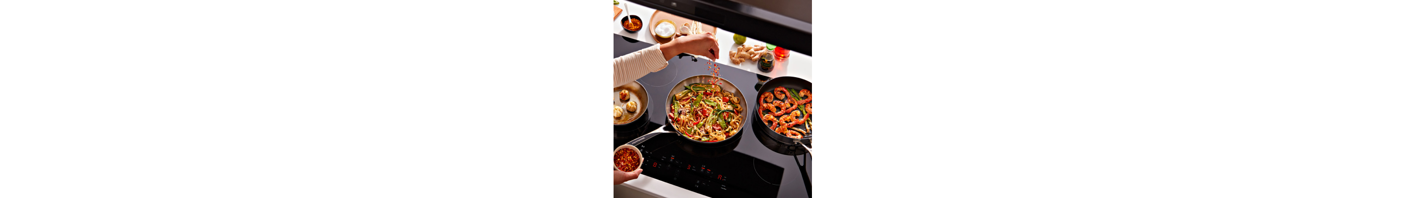 Person sauteing vegetables in a pan