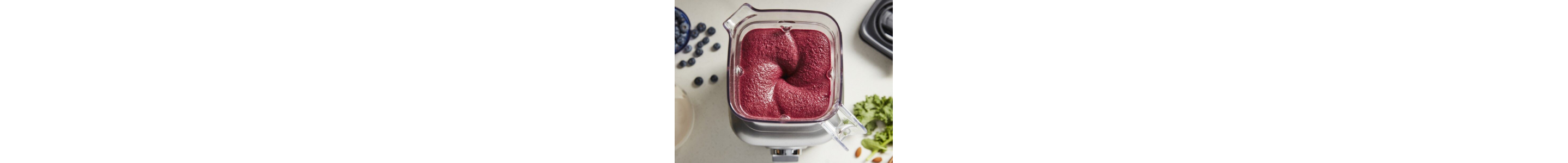 Top view of blender with top open and blended fruit mixture inside