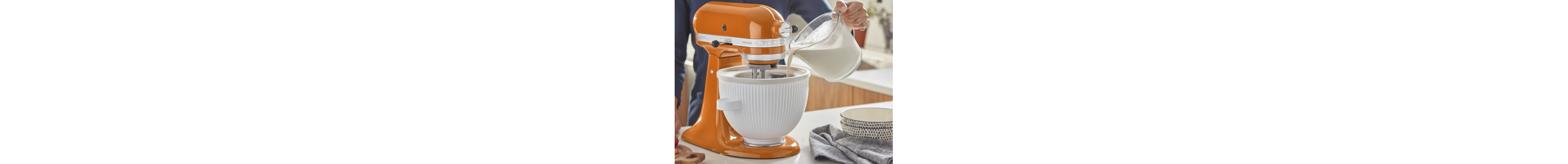 Pouring ice cream mixture into a Kitchenaid® stand mixer with ice bowl attachment