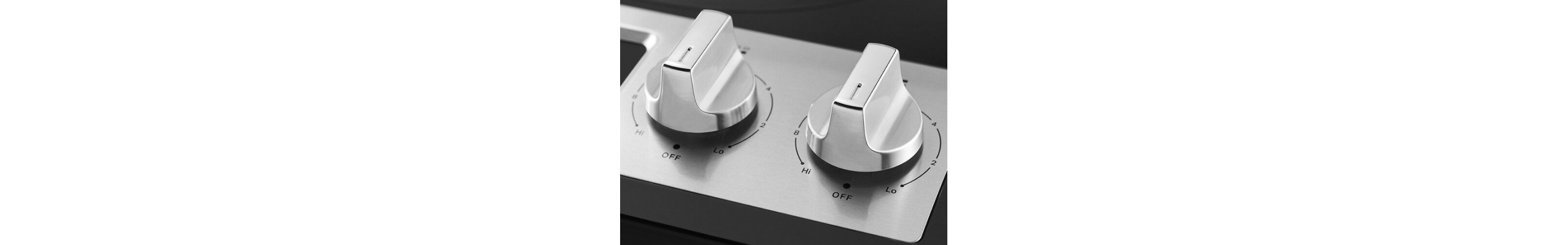 Close-up of silver burner knobs for electric stovetop