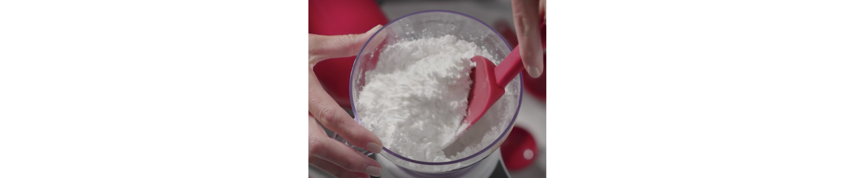 Spatula breaking clumps of flour