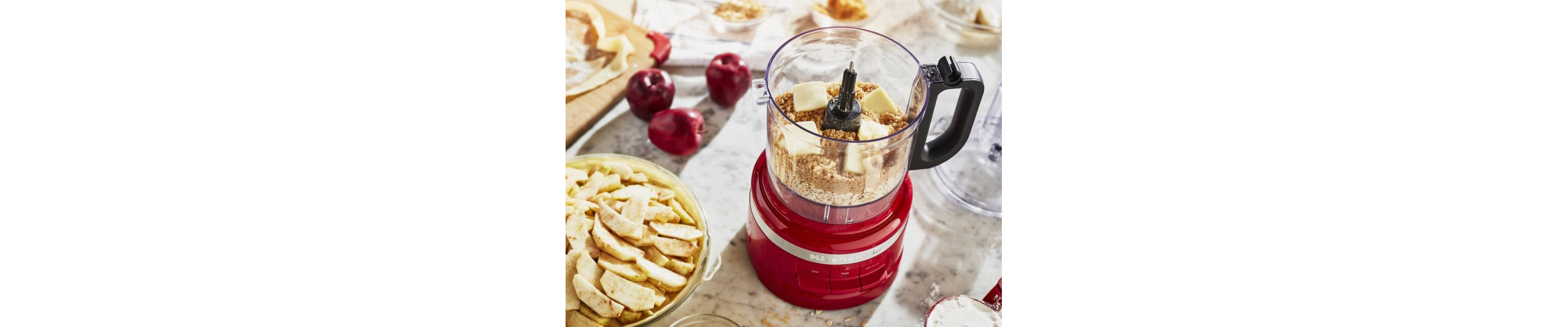 A food processor with butter and graham crackers