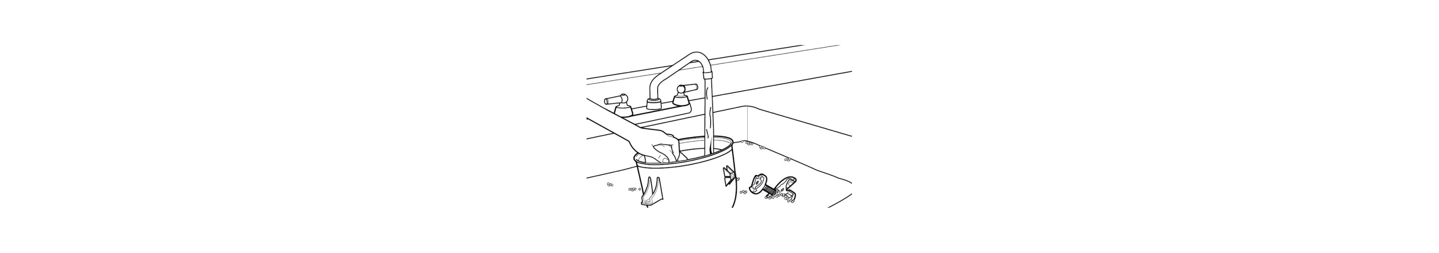 Hand washing ice cream maker parts in sink
