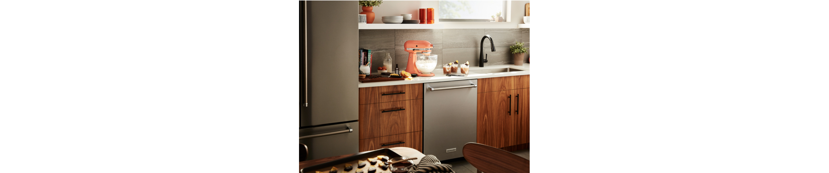 Orange KitchenAid® stand mixer on countertop