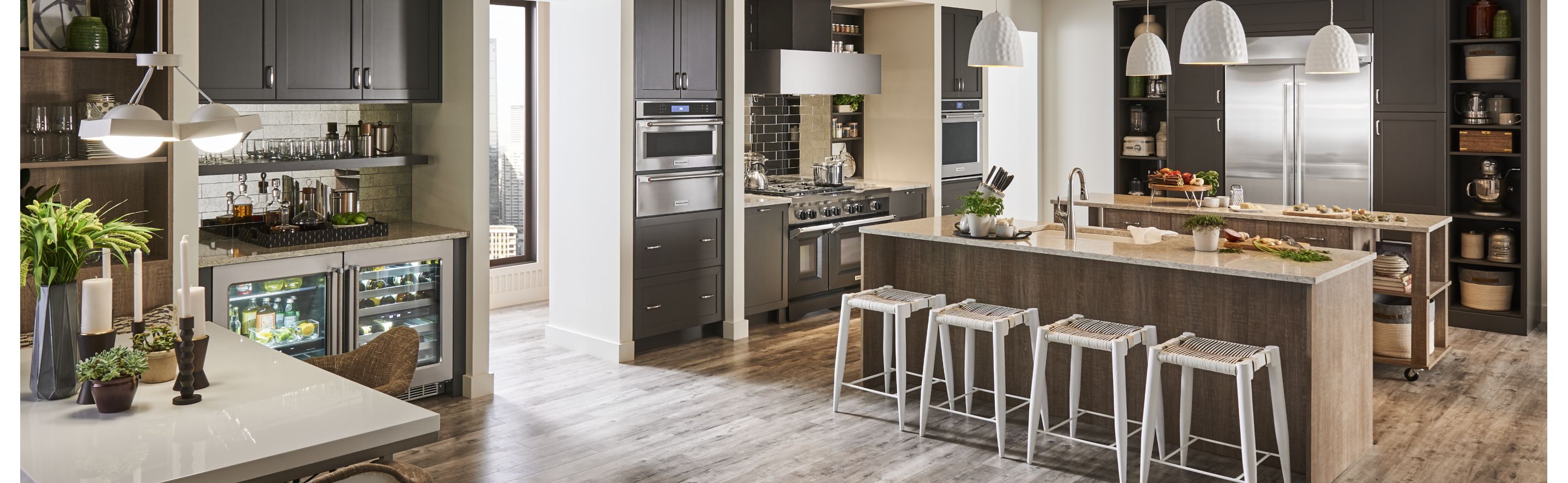 Large kitchen with built-in appliances and two islands