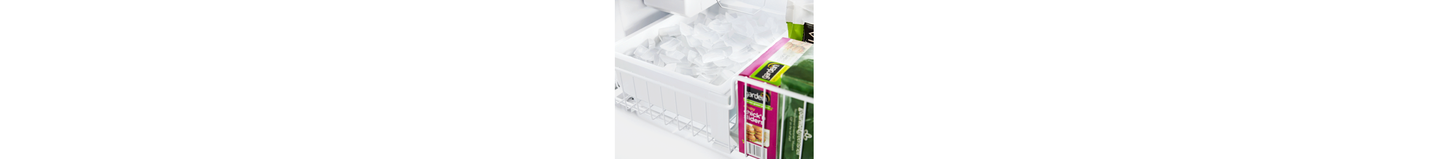 Tray full of ice inside a freezer