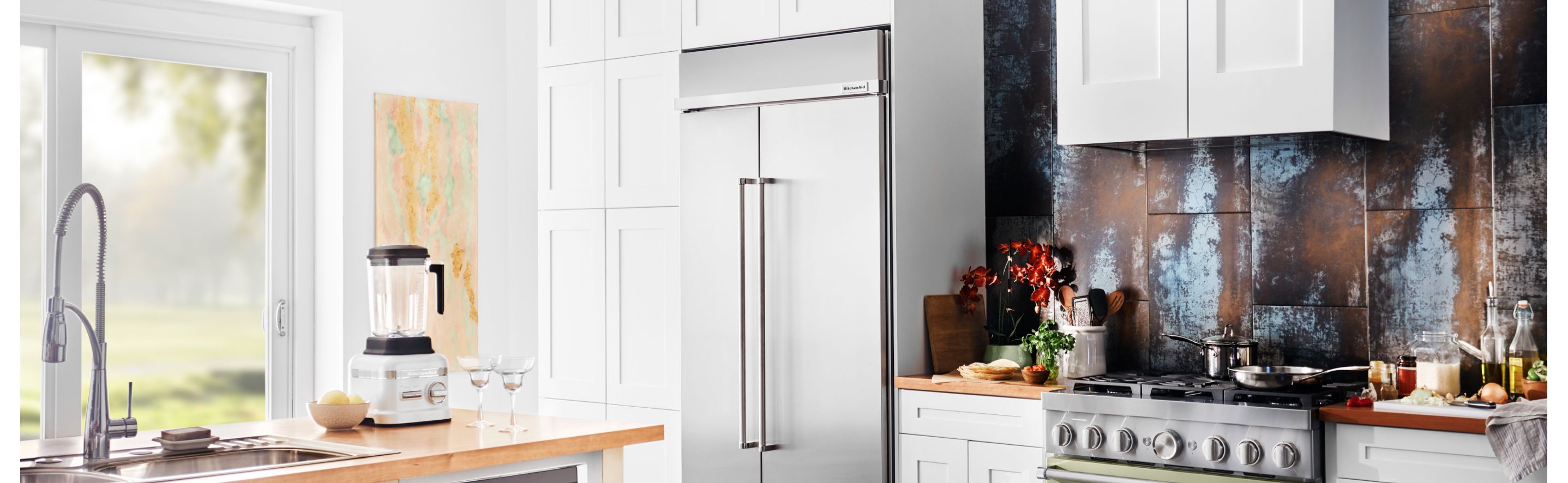 KitchenAid® Side-by-Side Refrigerator in a white kitchen