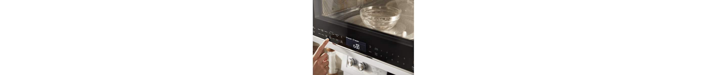 Person warming water in a microwave