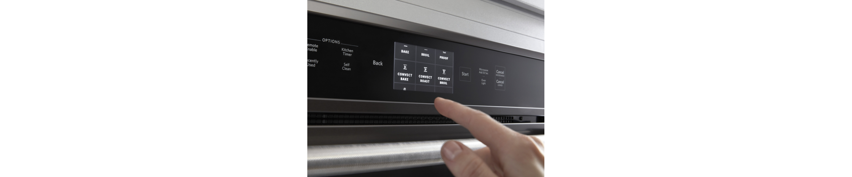 A person making an oven cycle selection