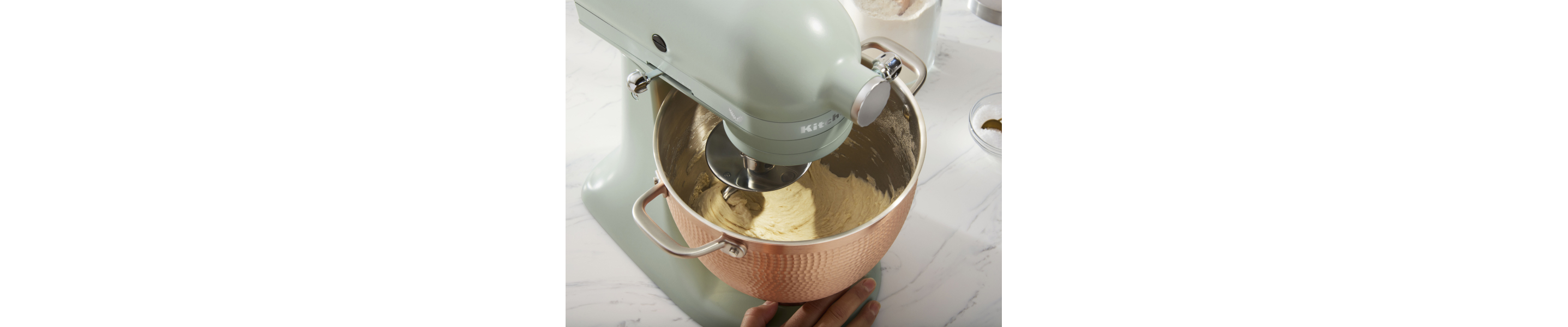 A stand mixer kneading dough
