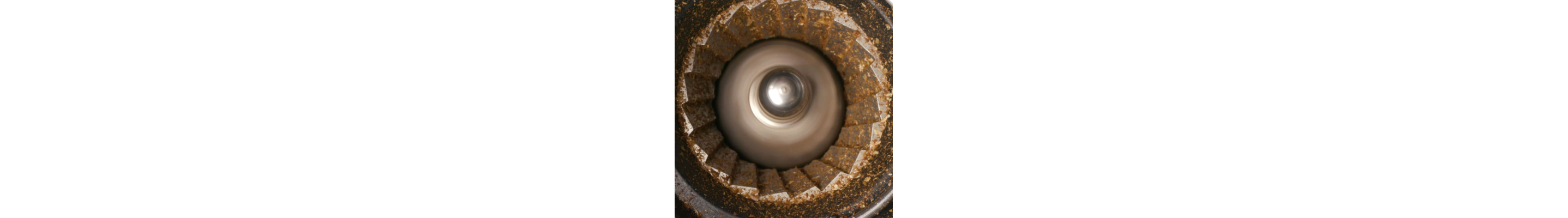 Coffee grinds in a burr coffee grinder