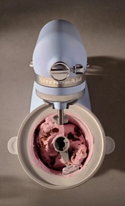 A person making ice cream using a KitchenAid® Stand Mixer