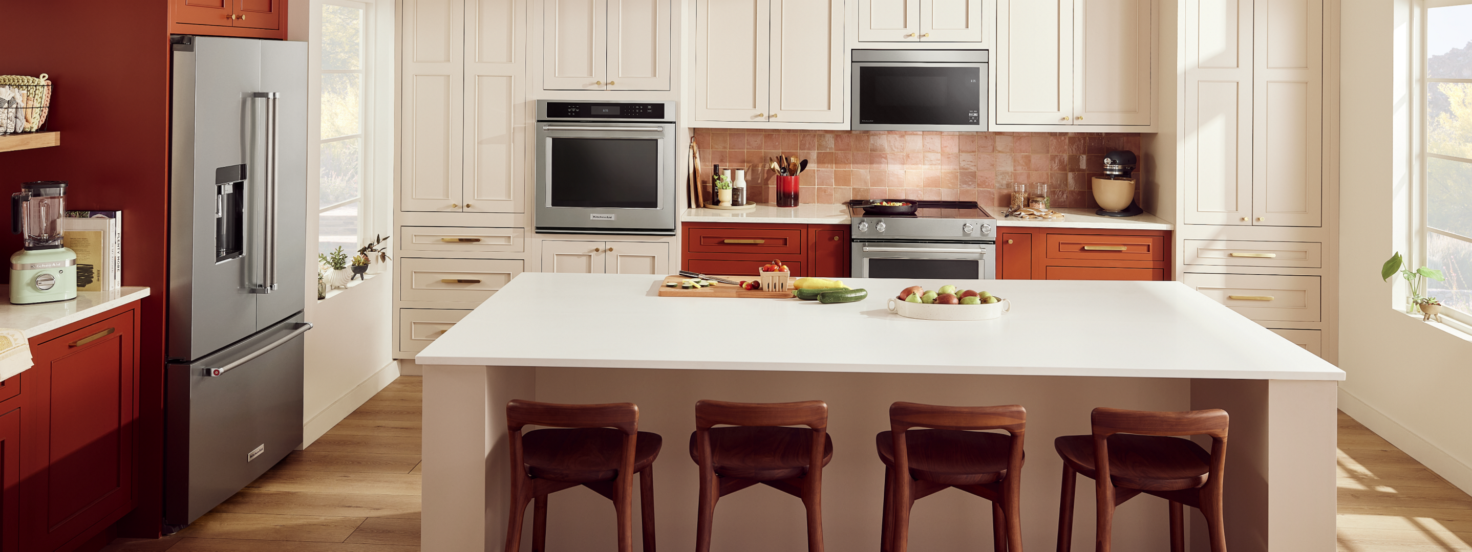 A contemporary kitchen featuring a suite of KitchenAid® appliances.