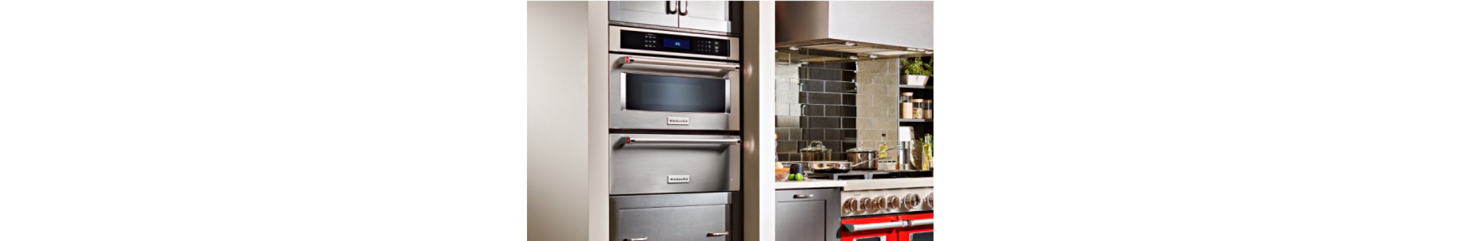 A built-in microwave in a light kitchen.